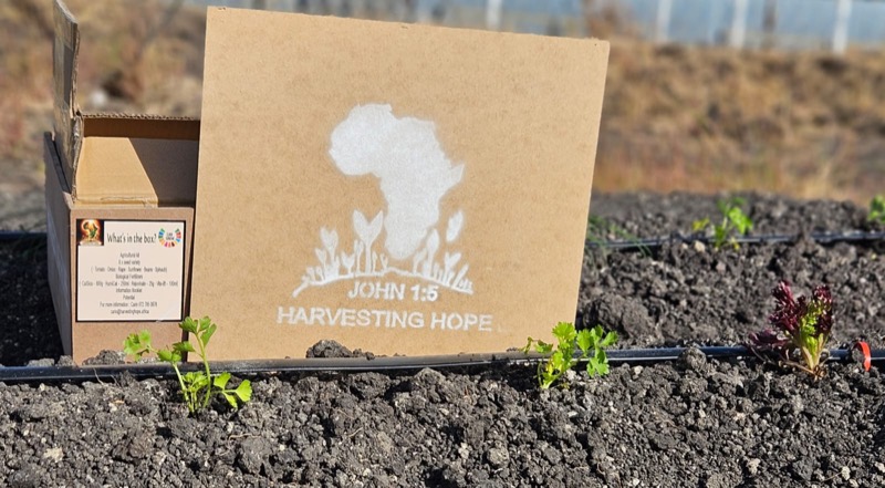 Harvesting Hope team delivering kits to a community